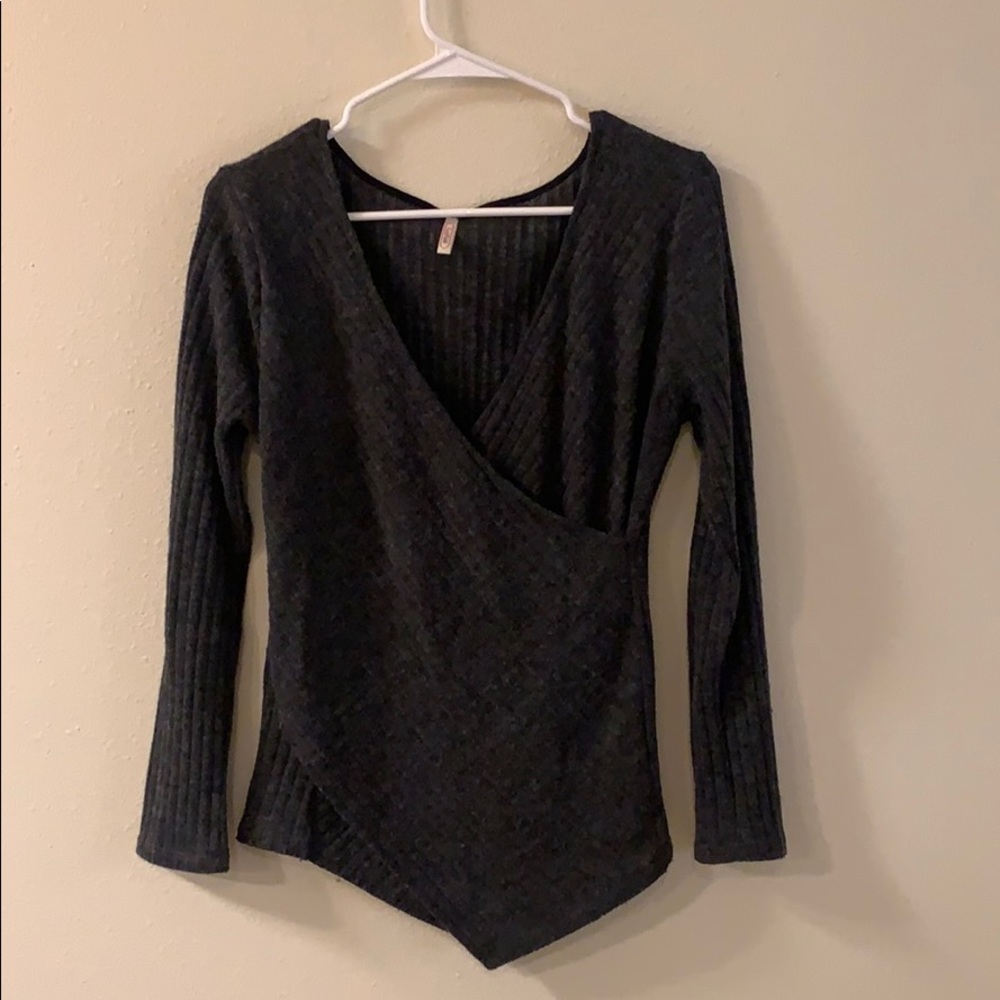 V-neck grey sweater.